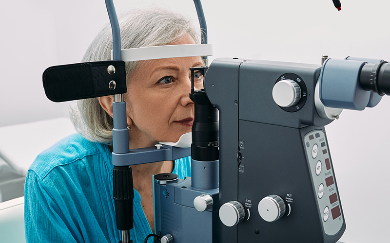 Female optometrist doing sight test to senior woman at modern ophthalmology clinic. Eye exam and vision diagnostic Eye Exams in Snowmass Village & Lone Tree, CO